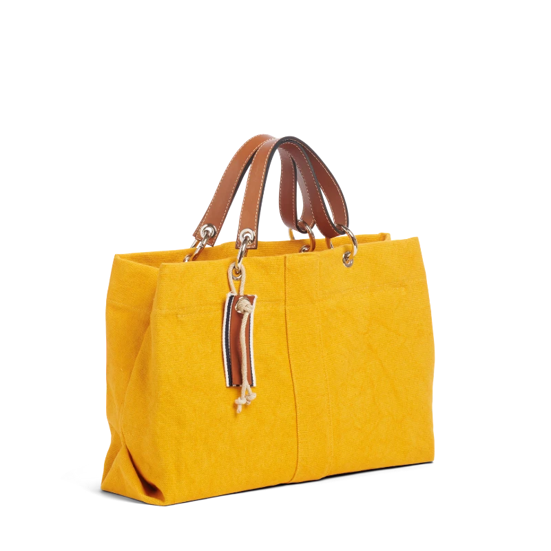 sac de ville modulable en coton jaune avec des anses en cuir naturel