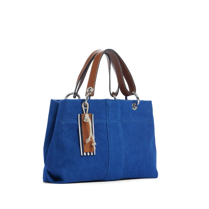 sac de ville modulable en coton bleu roi avec des anses en cuir naturel