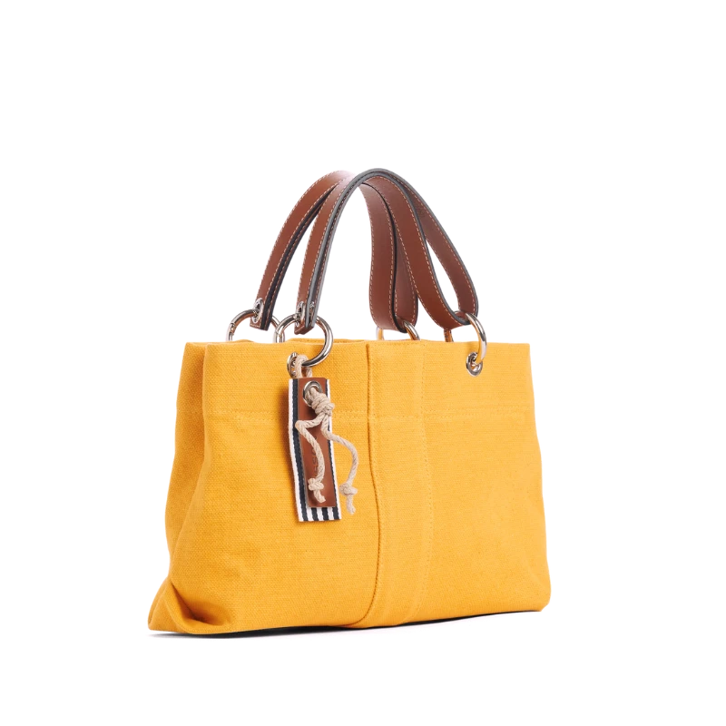 sac de ville modulable en coton jaune avec des anses en cuir naturel
