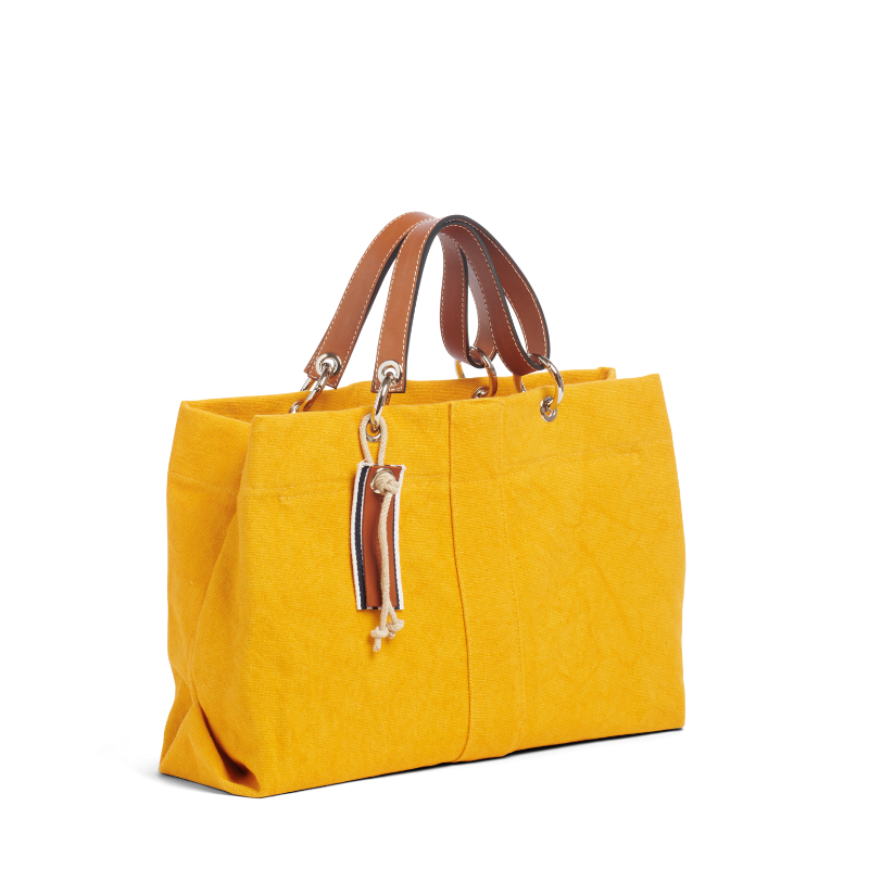 sac de ville modulable en coton jaune avec des anses en cuir naturel