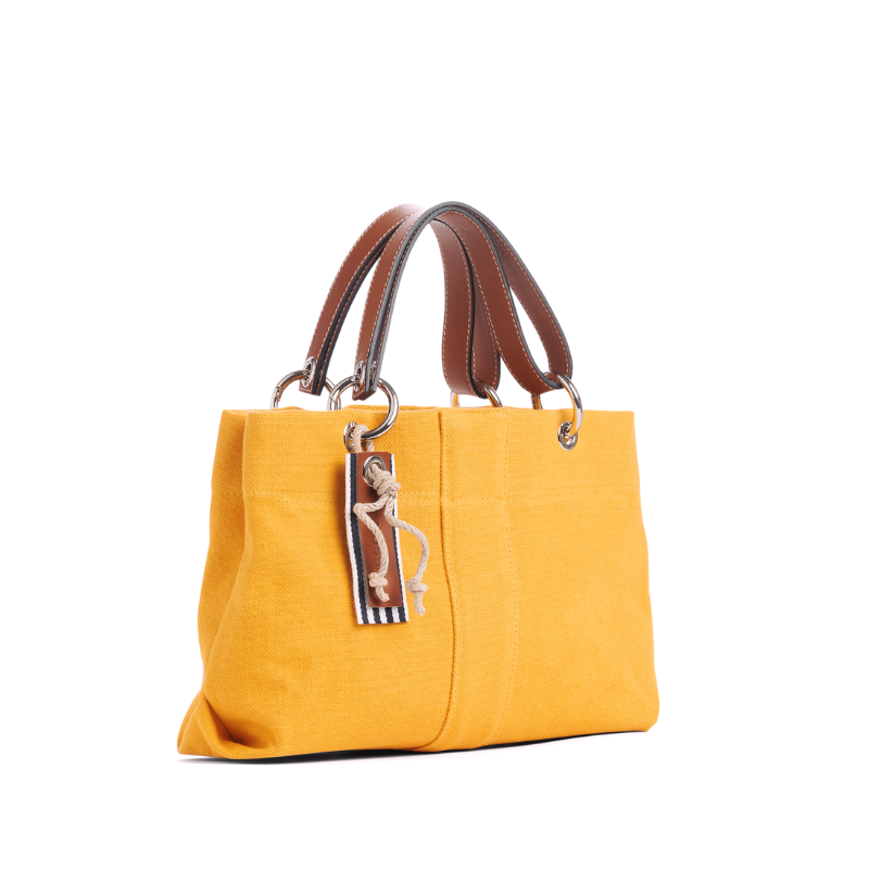 sac de ville modulable en coton jaune avec des anses en cuir naturel